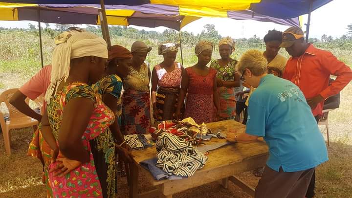 A volunteer training with widows in the community skills program